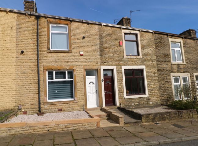 A house exterior with a front door and windows at Victoria Place in Accrington