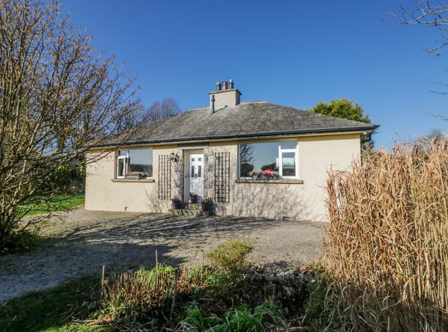 A house with windows and a door at Linden Lea in Grange-Over-Sands