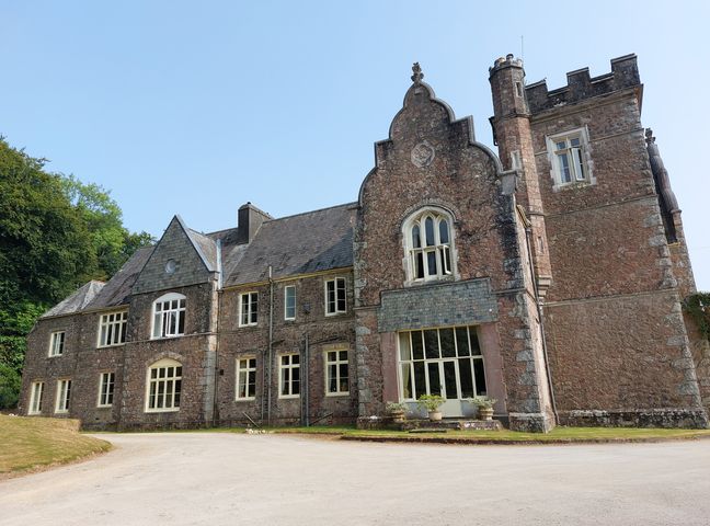 A historic building with multiple windows at Lukesland Wing near Ivybridge