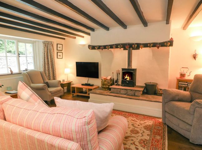 A living room with a sofa and fireplace at Ingleton 2-Bed Cottage, Sleeps 4, Pet Ok & Parking Ingleton