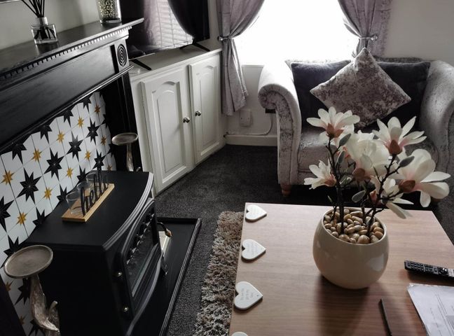 A living room with a sofa and coffee table at Stunning 2-Bed House in Macclesfield Cheshire