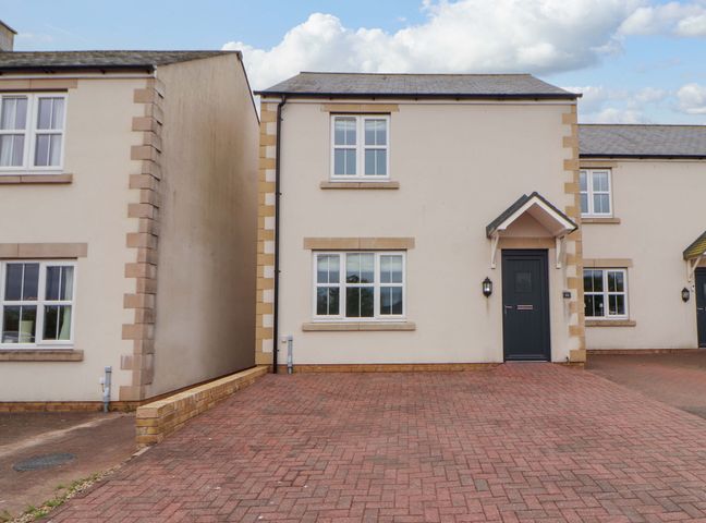 A house with a driveway and windows at 11 The Forge Brampton