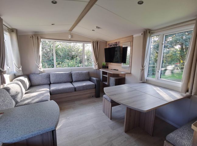 A living room with a sofa and television at 8Berth- SmartTV- CloseToBeach- FamilyFriendly in Mablethorpe