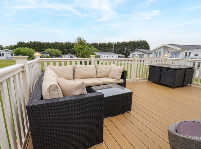 An outdoor seating area with a sofa and table at Finch 66 in Scarborough
