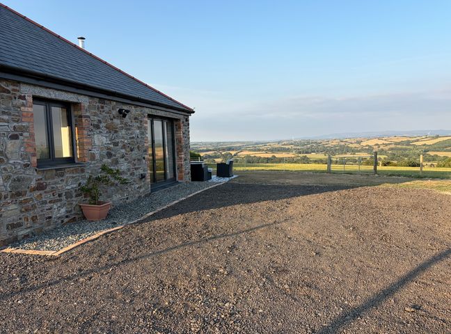 An outdoor area with stone wall and gravel at Up Top in Launceston