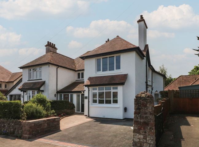 A house with windows and a driveway at Wendy's Cottage Minehead