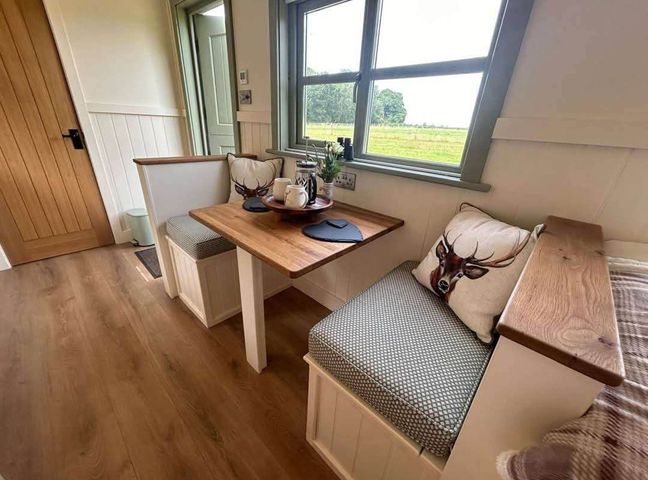 A dining area with a table and seating at an unknown location near Bishop's Waltham