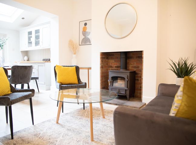 A living room with a coffee table and wood stove at York Minster 3bed Sleeps 6 Fireplace Free Parking in York