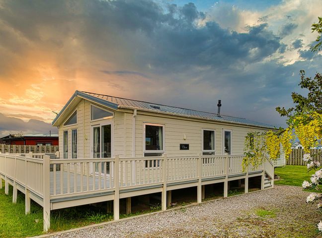 A house with a deck and garden at Cheri in Southerness