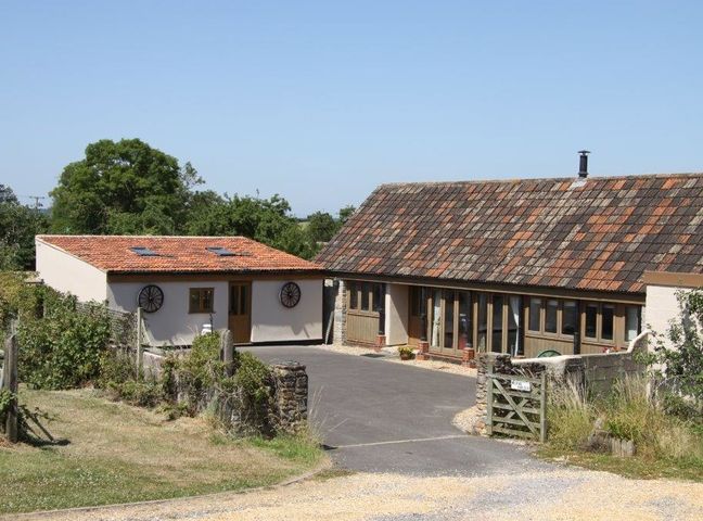 A property with two buildings with tiled roofs and a driveway at The Milking Parlour in Wookey