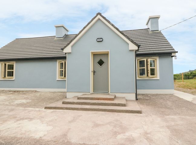 A single story house with blue walls brown door and multiple windows at Dromstabla in Glencar