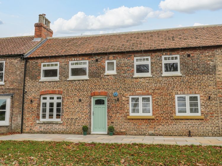 A former groom's cottage in the Cotswolds with deeply personal