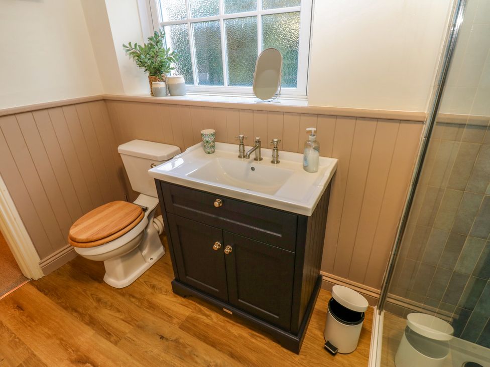 A bathroom with a sink and toilet at Old Workhouse Cottage in Stanhope