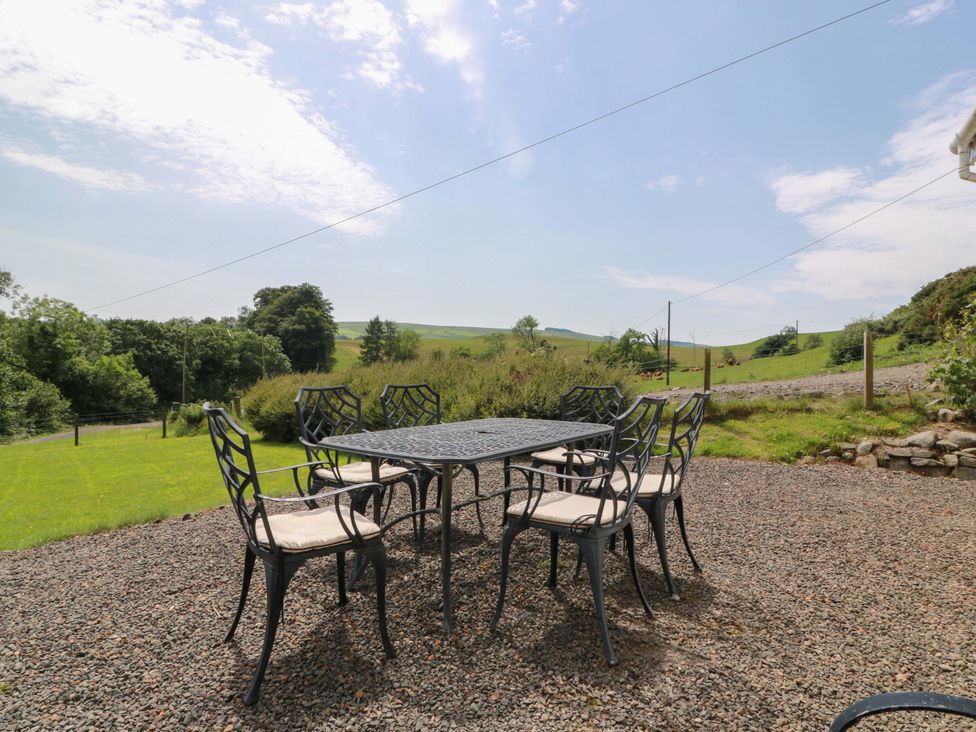 A table and chairs in an outdoor area at Cairnhill in Girvan