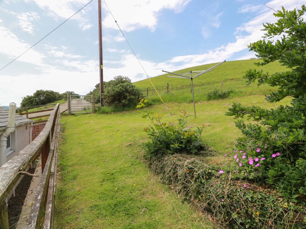 A garden with a clothesline and gate at Cairnhill in Girvan