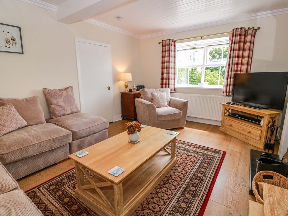 A living room with sofa and television at Cairnhill in Girvan