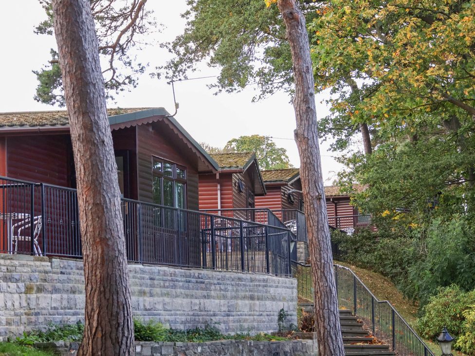 A view of cabins with balconies and stairs at Foxglove Lodge in Saltburn-By-The-Sea
