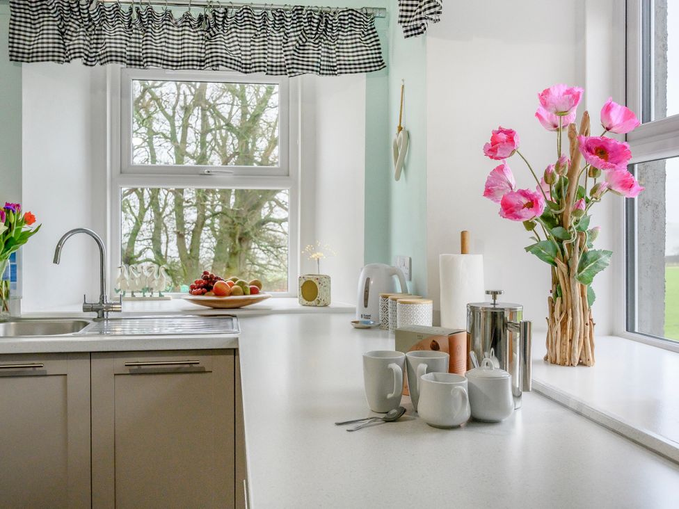 A kitchen with a sink and window at Birds Nest in Jedburgh
