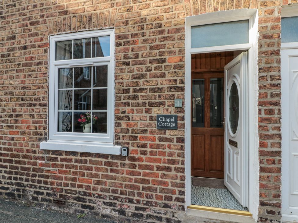 Exterior view of a door and window at Chapel Cottage in Filey