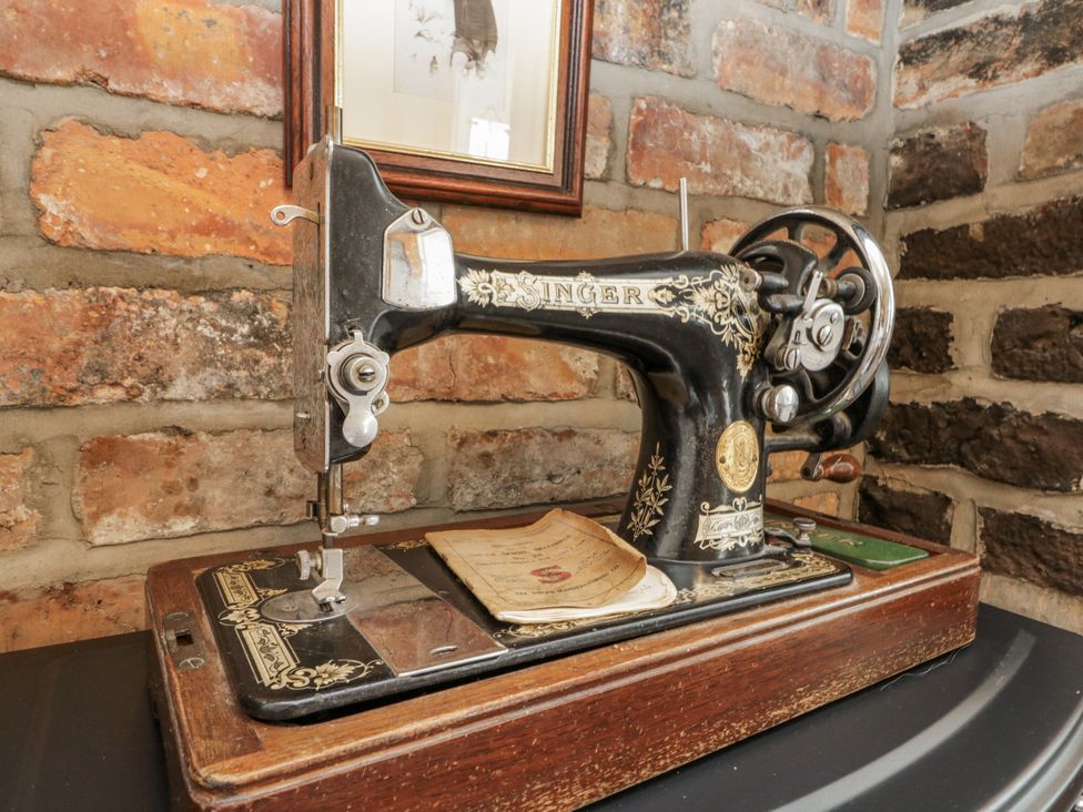 A vintage Singer sewing machine on a table at Chapel Cottage in Filey