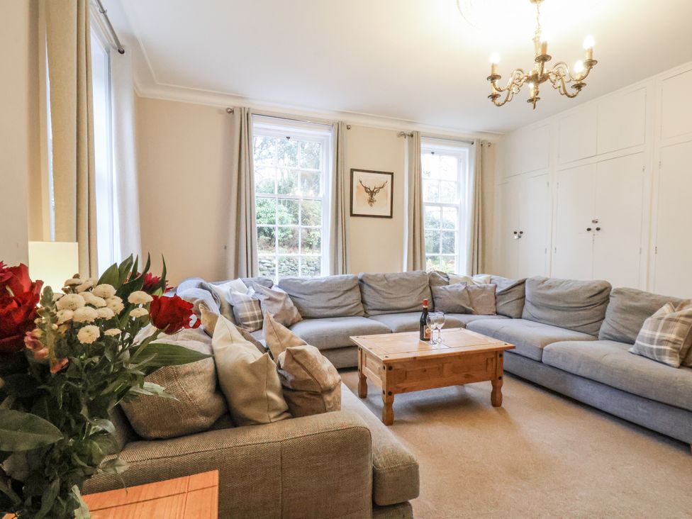 A living room with a sofa and table at The Manor House in Scarborough