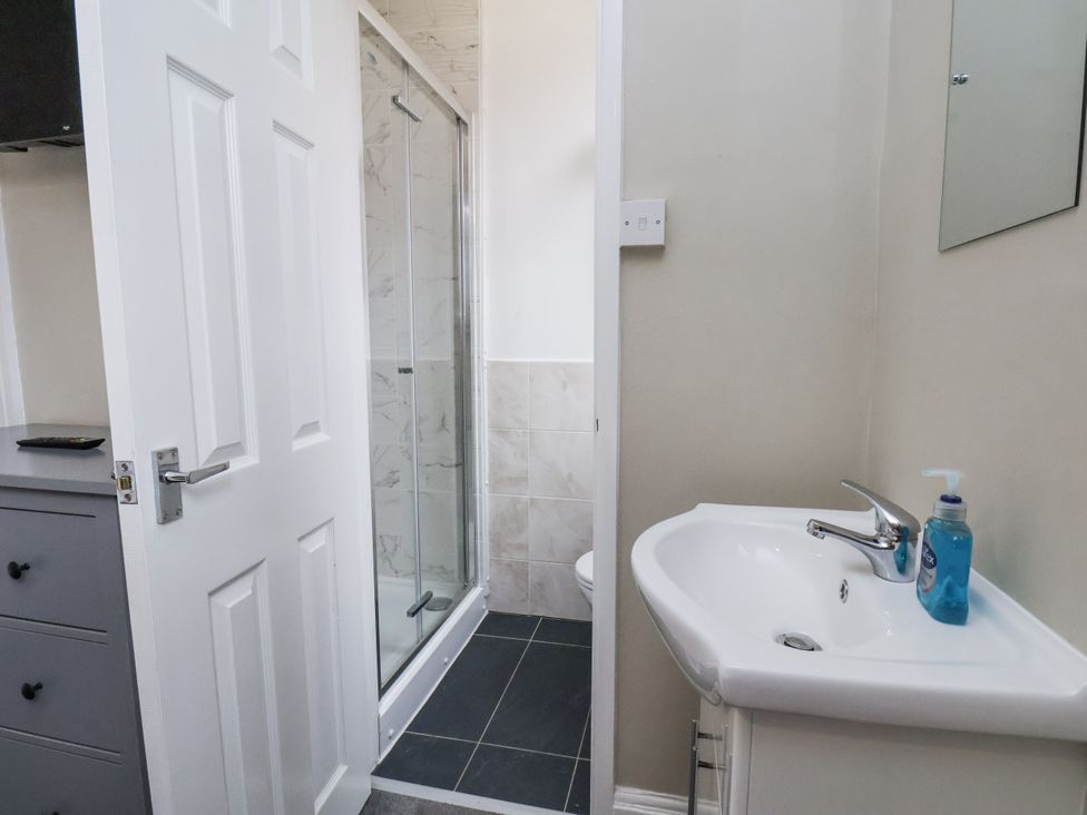 A bathroom with a sink and shower at Tennyson House in Scarborough