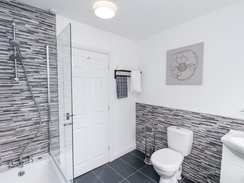 A bathroom with a bathtub and shower at Tennyson House in Scarborough