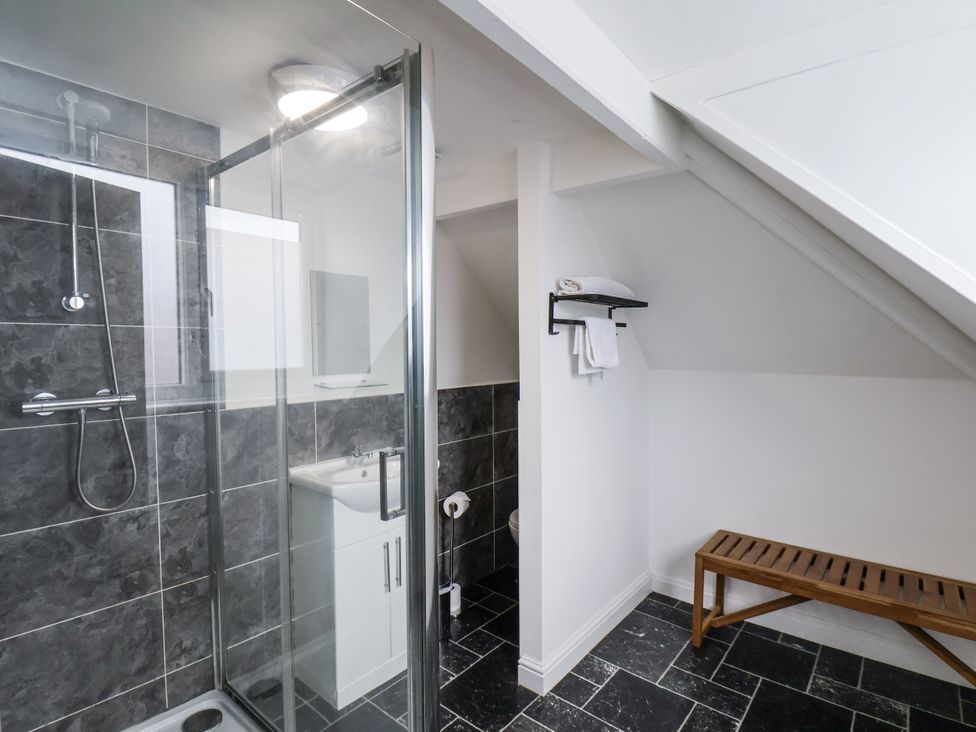 A bathroom with a shower, sink, and toilet at Tennyson House in Scarborough