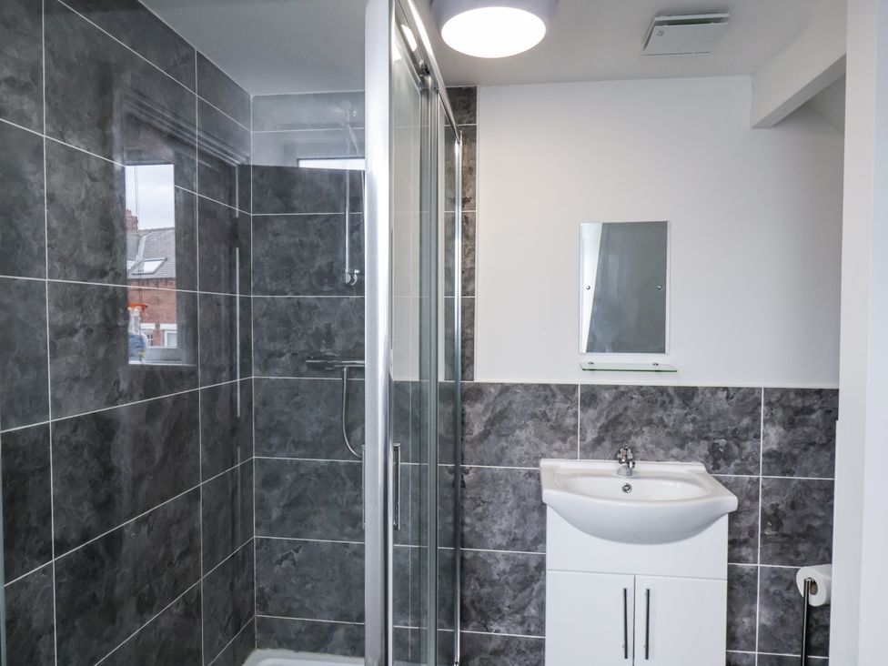 A bathroom with a shower and a sink at Tennyson House in Scarborough