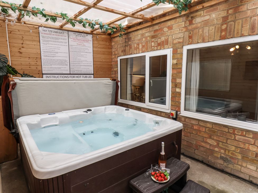 A hot tub with instructions on the wall at Tennyson House in Scarborough