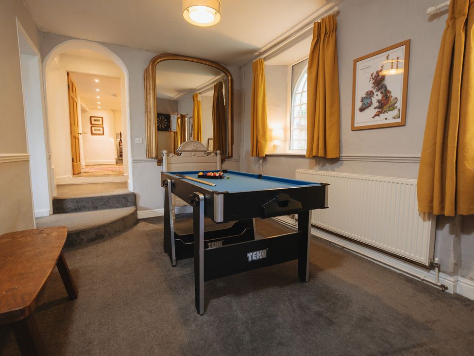 A games room with a pool table at Cwmalis Hall in Llangollen