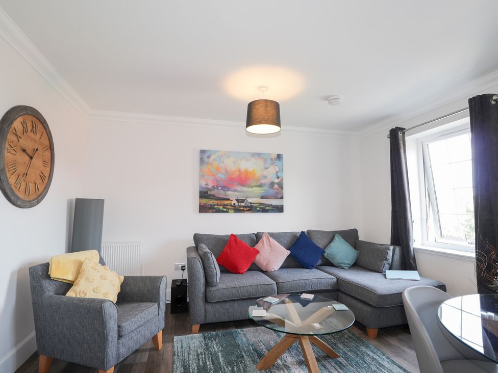 A living room with a sofa and coffee table at The Nook in Culloden