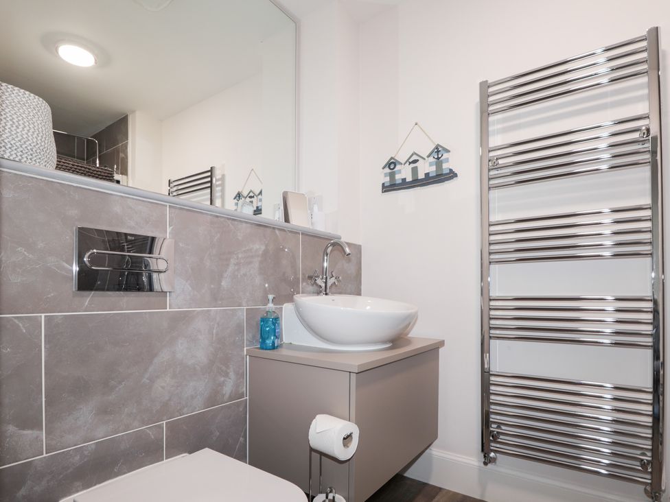 A bathroom with a sink and toilet at The Nook in Culloden