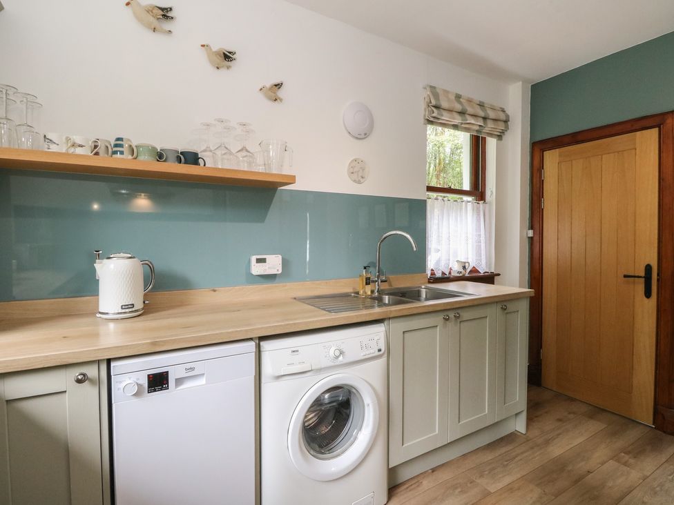A kitchen with appliances and utensils at Clearwater House in Roshven near Glenuig