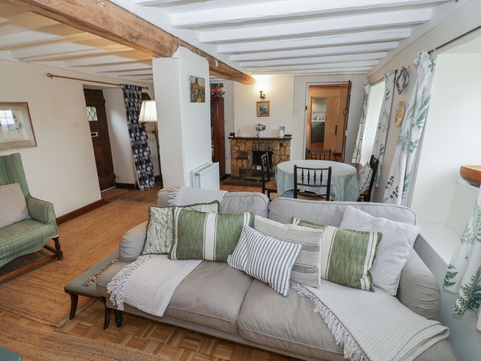 A living room with a sofa and coffee table at Priors Mead in Claydon near Cropredy