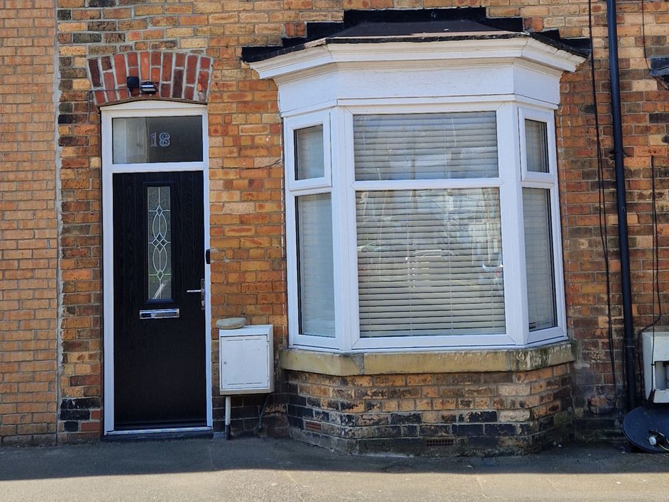 A front entrance with a door and bay window at 18 Howard Street Scarborough