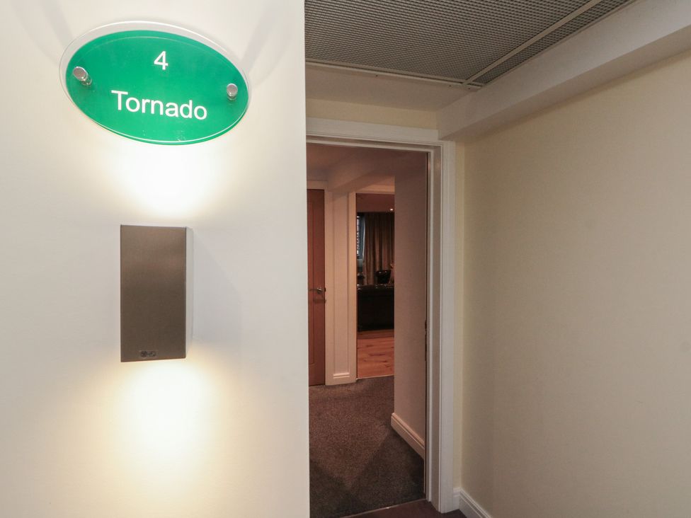 A hallway with a door and nameplate at Tornado @ Engine Shed in Whitby