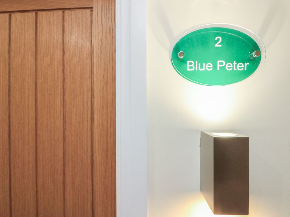 A door with a sign indicating Blue Peter at Blue Peter @ Engine Shed in Whitby