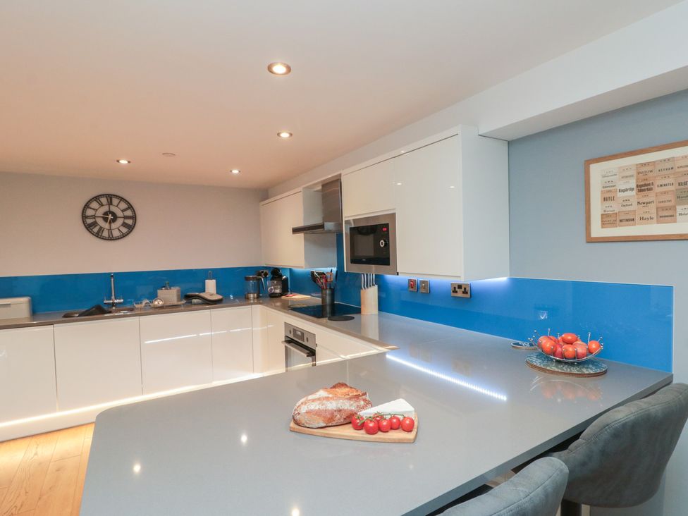 A kitchen with a countertop, sink, and oven at Blue Peter @ Engine Shed in Whitby