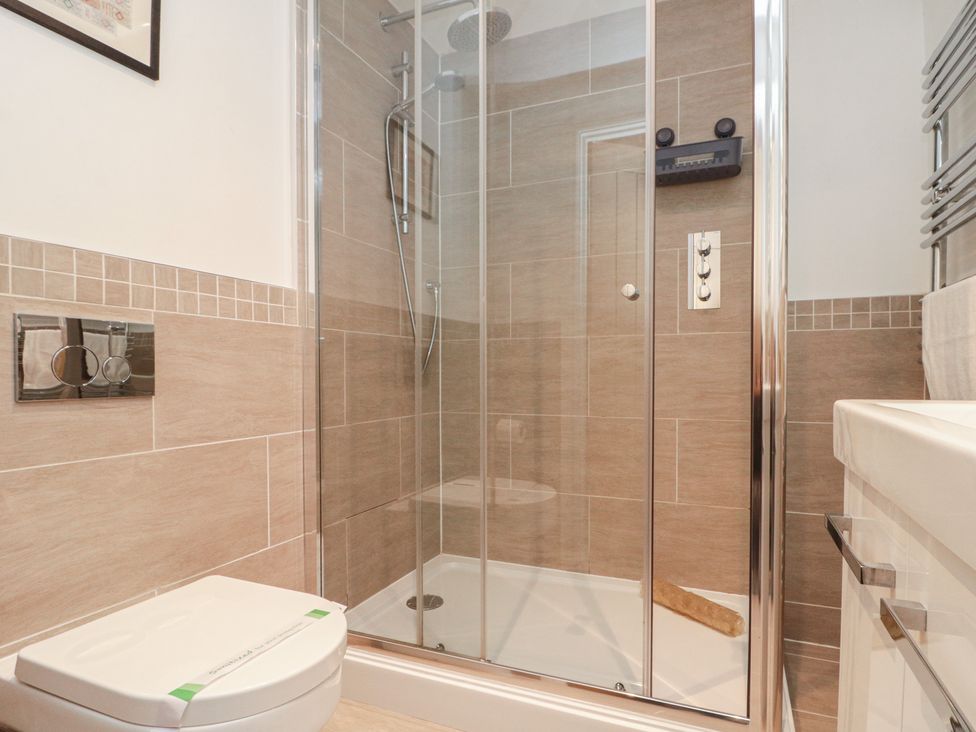 A bathroom with a shower and toilet at Blue Peter @ Engine Shed in Whitby