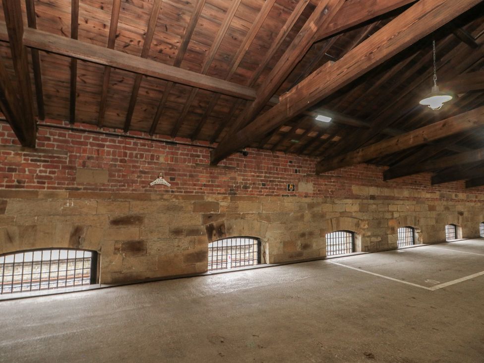 An indoor space with wooden beams and brick walls at Blue Peter @ Engine Shed in Whitby