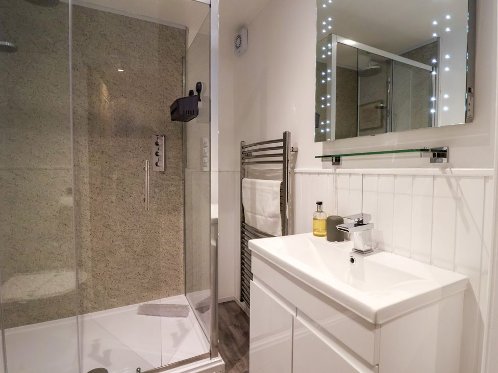 A bathroom with a shower and sink at Blue Peter @ Engine Shed Whitby