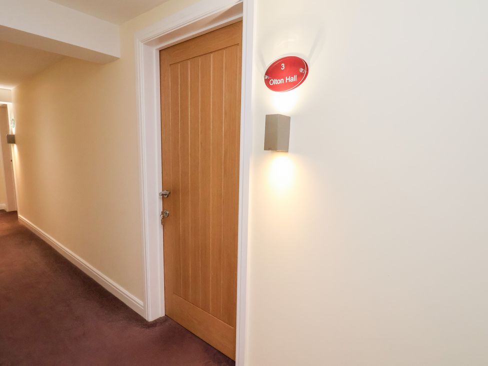A hallway with a door labeled Olton Hall at Olton Hall @ Engine Shed in Whitby