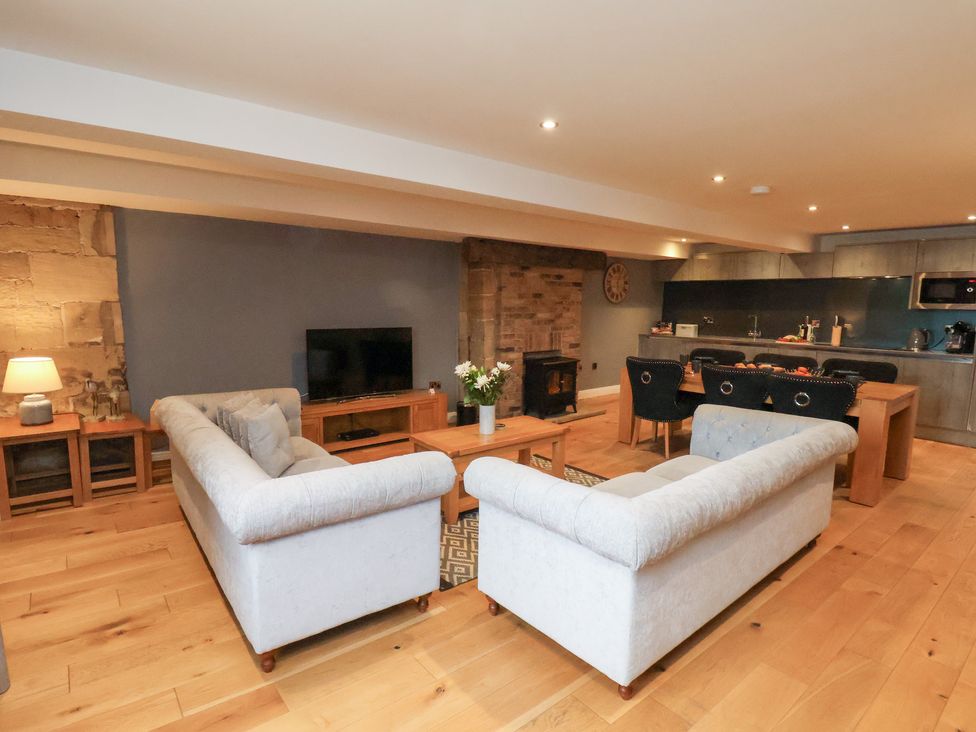 A living room with a television and fireplace at Mallard @ Engine Shed in Whitby