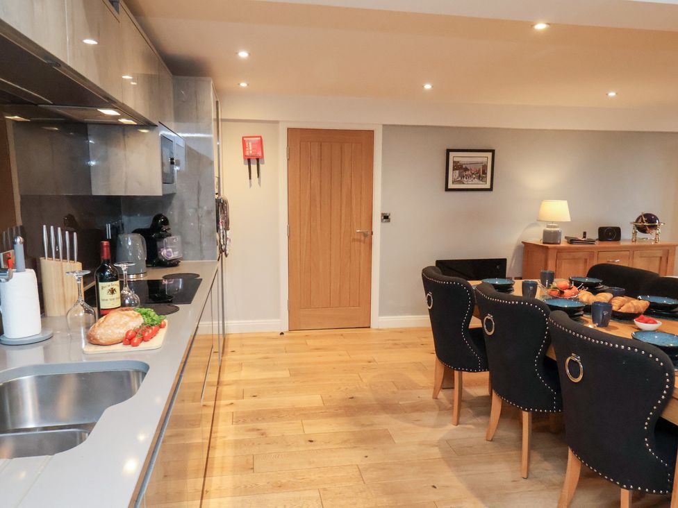 A kitchen with dining area at Mallard @ Engine Shed Whitby