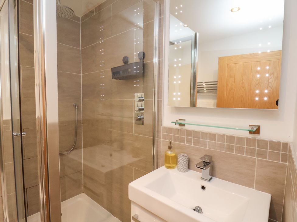 A bathroom featuring a shower and sink at Mallard @ Engine Shed in Whitby