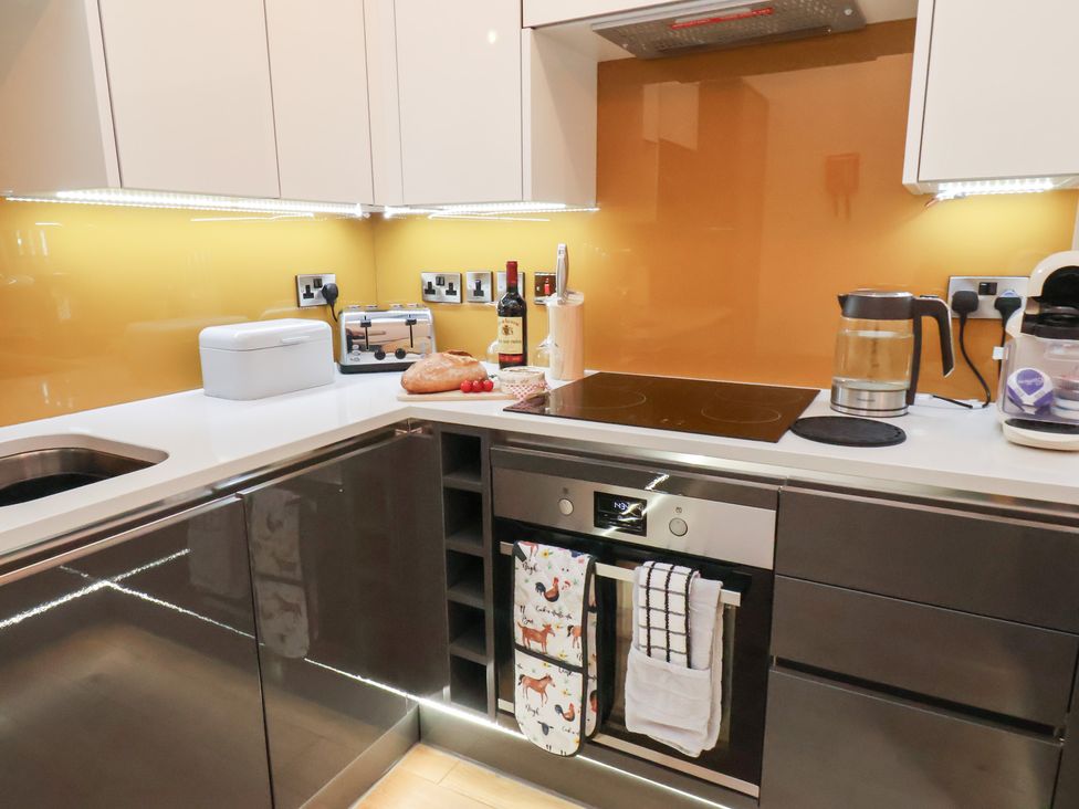 A kitchen with appliances and utensils at Evening Star @ Engine Shed in Whitby