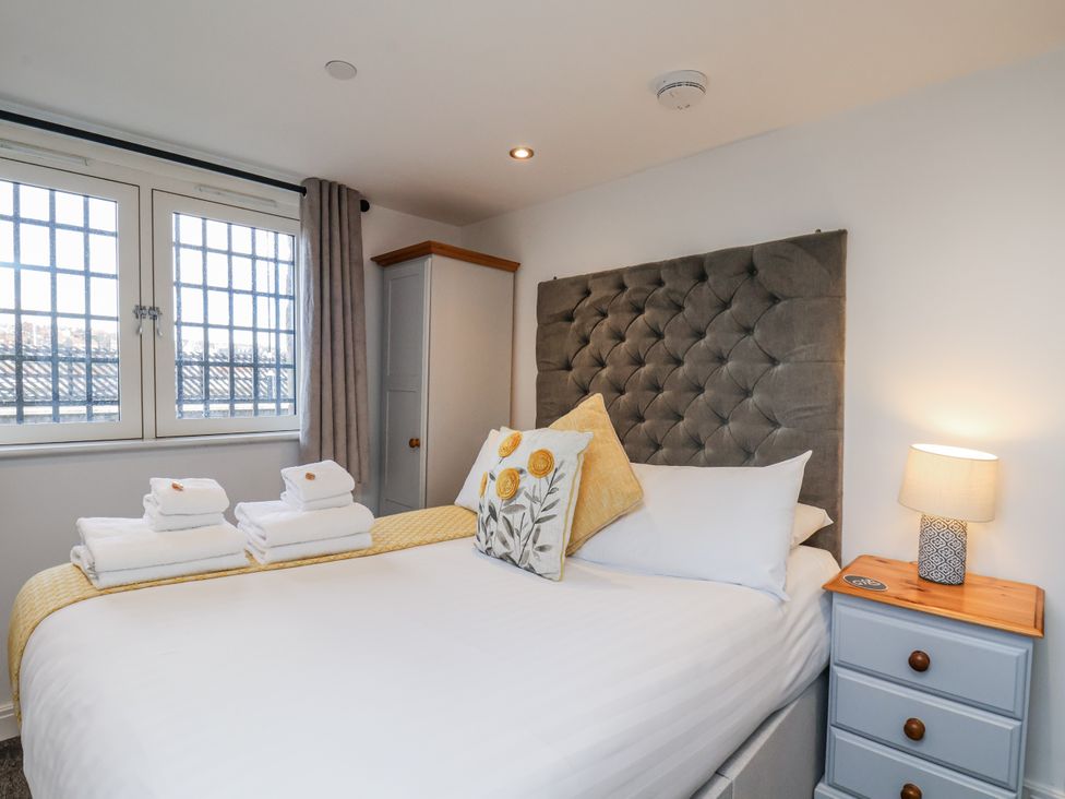 A bedroom with a bed and bedside table at George Stephenson @ Engine Shed in Whitby