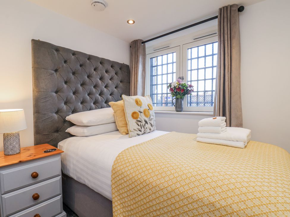 A bedroom with a bed and pillows at George Stephenson @ Engine Shed, Whitby