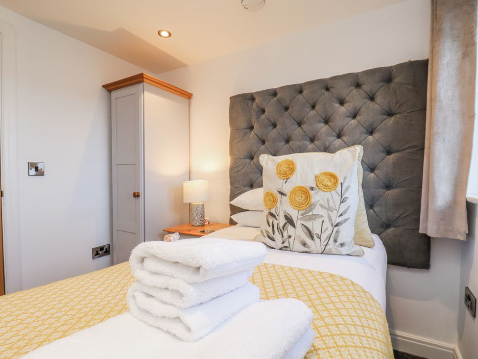 A bedroom with a bed and bedside lamp at George Stephenson @ Engine Shed in Whitby